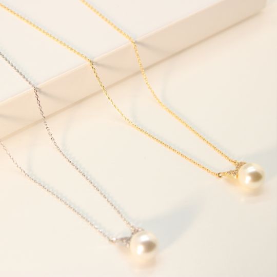 Pearl Bowtie Charm Necklace in Yellow Gold and White Gold Color